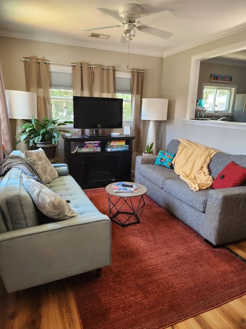 Living room with two couches and a fireplace insert