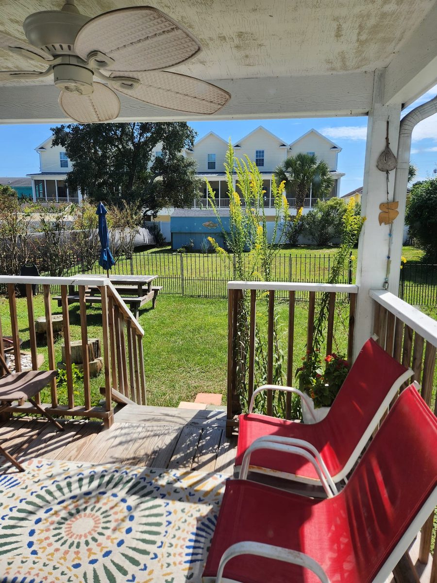 The covered porch looking out over the yard