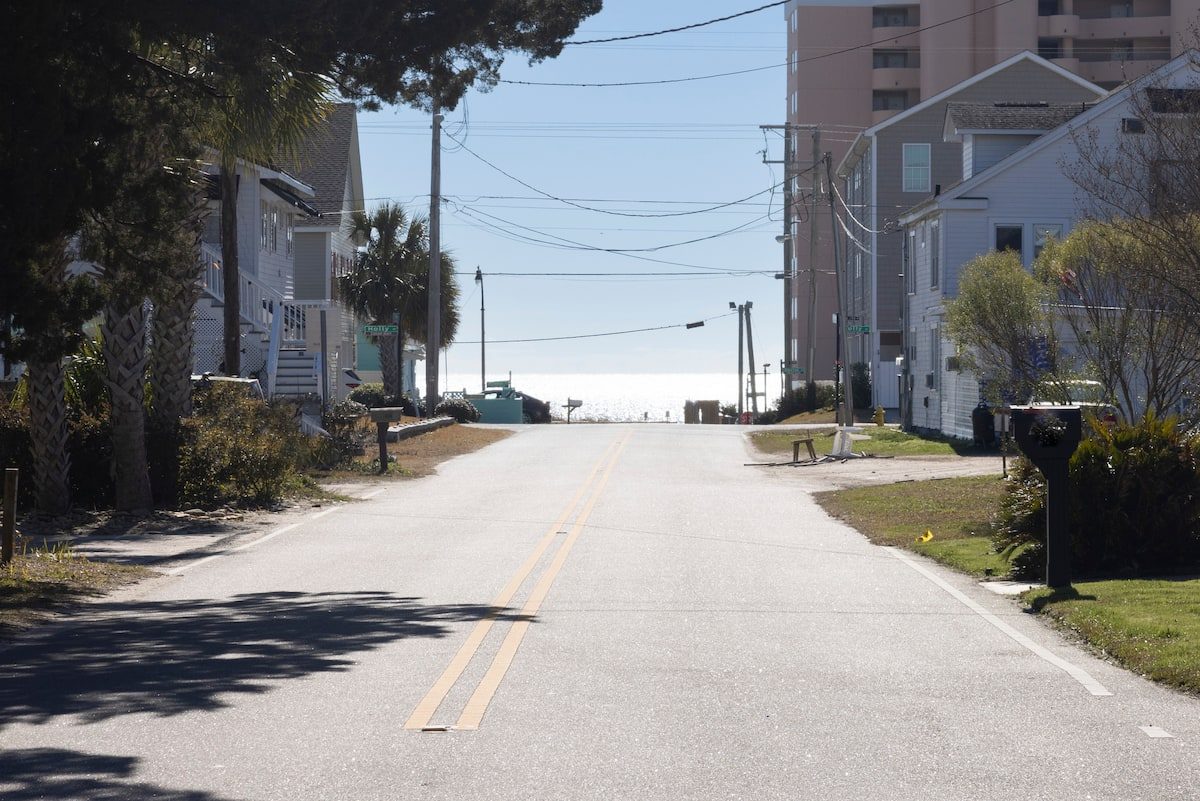 The neighborhood street looking straight toward the ocean